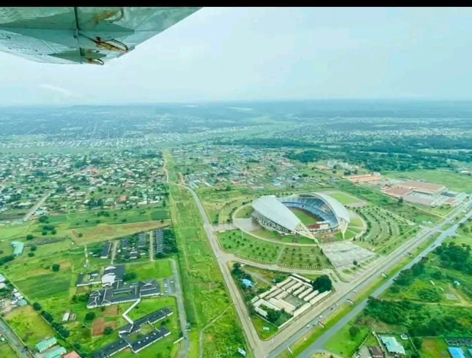 Aerial view of Heroes National Stadium and surrounding city